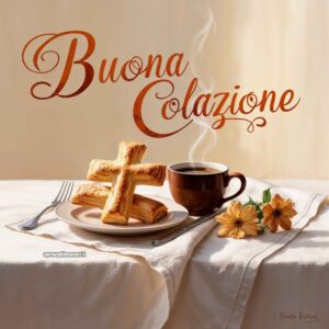 Una colazione semplice su un tavolo con tovaglia chiara, composta da una tazza di caffè e croissant disposti a formare una croce, con due fiori decorativi accanto. Sopra la scena è scritto &quot;Buona Colazione&quot;.